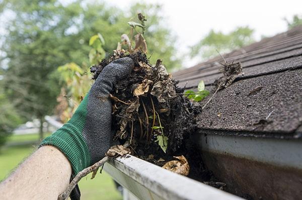 we utilize a combination of hand removal and pressure washing for thorough gutter cleaning